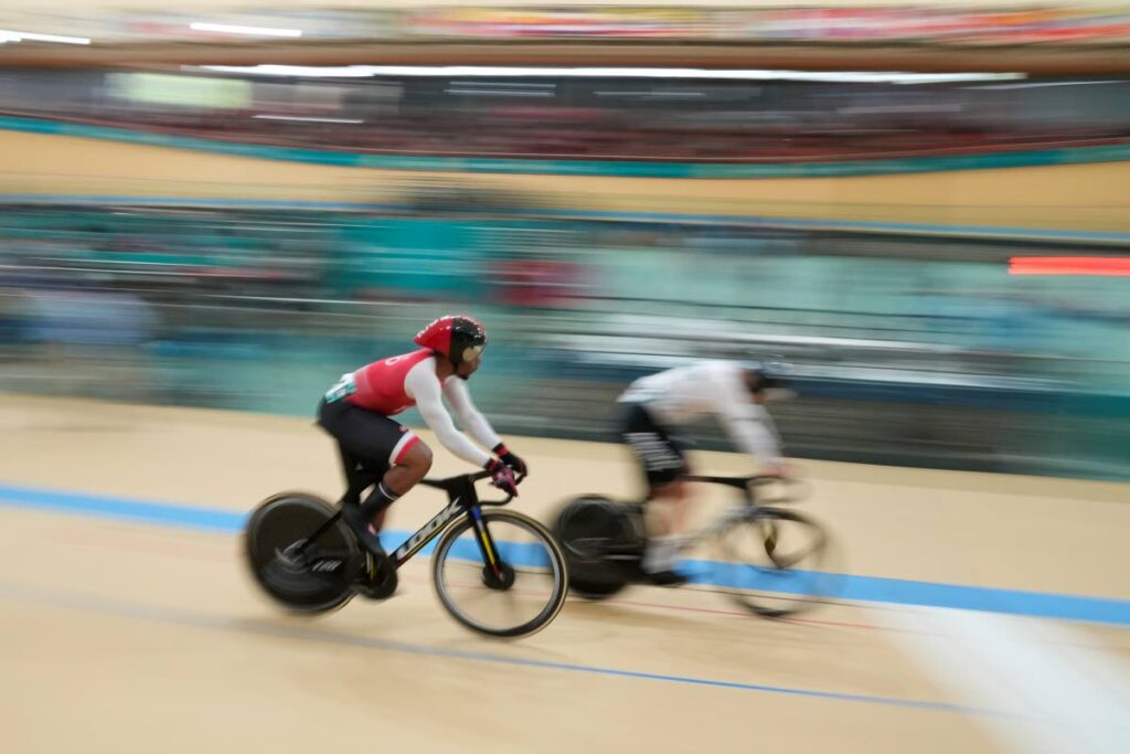 Mexico's Juan Ruiz, right, races Trinidad and Tobago's Nicholas Paul during the men's cycling track sprint qualifier at the Pan American Games in Santiago, Chile, on Wednesday.  - AP PHOTO