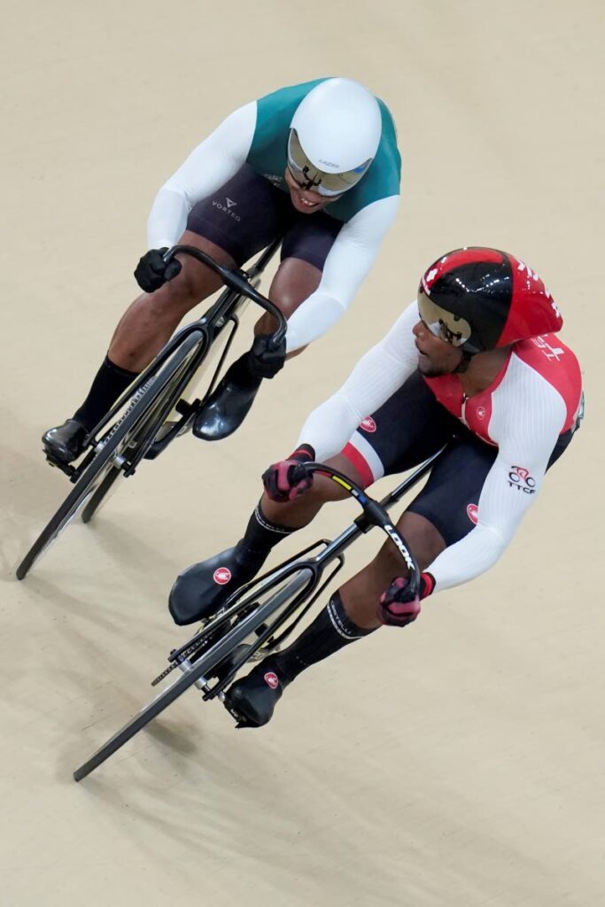 Trinidad and Tobago's Nicholas Paul, right, and Suriname's Jair Tjon, compete in the men's sprint final at the Pan American Games in Santiago, Chile, on Thursday.  - AP PHOTO