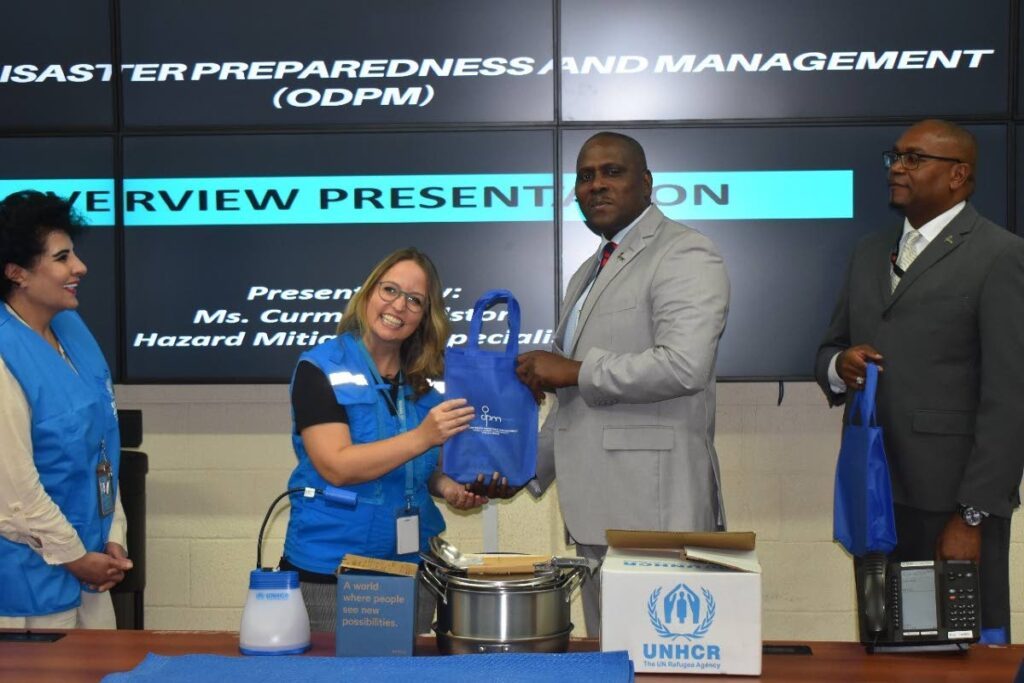 ODPM’s chief executive officer Major General (Retired) Rodney Smart, presented a token of thanks to UNHCR’s national office head, Miriam Aertker. - Photo courtesy UNHCR