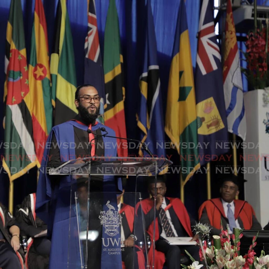 Valedictorian Kyle Bisnath, from the University of the West Indies (UWI) Faculty of Social Sciences, delivers an address at his graduation ceremony at UWI SPEC, St Augustine last Friday. - Photo by Joey Bartlett