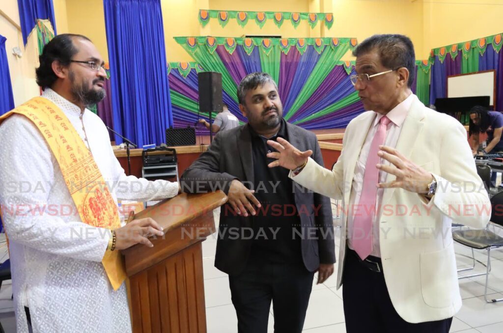 Former attorney general Ramesh Lawrence Maharaj, right, speaks to  MP for Chaguanas West Dinesh Rambally, left, and Kiel Taklalsingh Maha Sabha headquarters, St Augustine on Saturday.  - ROGER JACOB