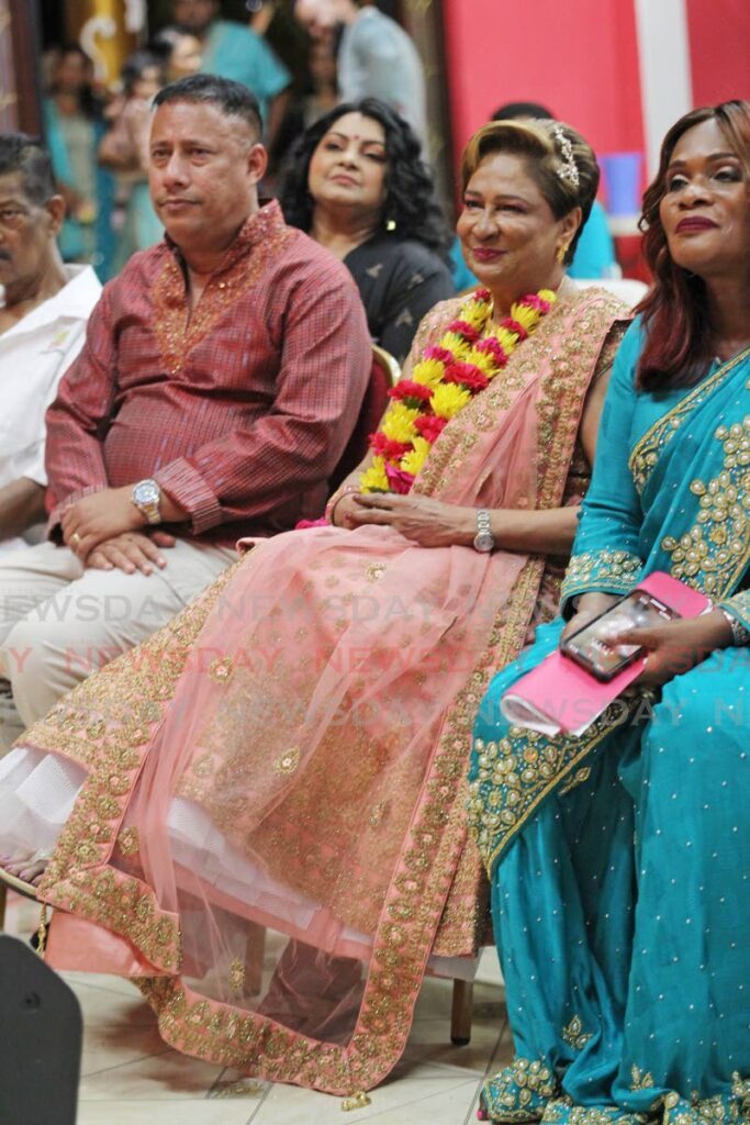 UNC leader Kamla Persad-Bissessar, centre, National Transformation Alliance political leader Gary Griffith, left, and UNC deputy political leader Jearlean John attended the Rochard Road Shiva Mandir for Divali celebrations on Saturday night. - Photo by Lincoln Holder