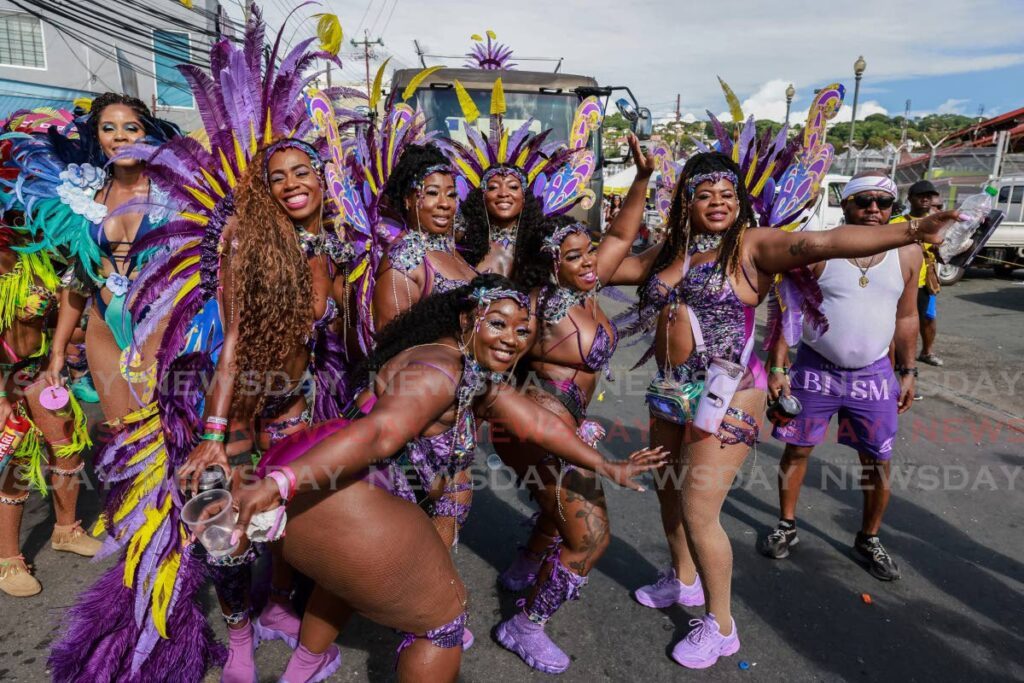 Revellers in Zain Carnival Experience band have a ball in Scarborough on Sunday. - Photo by Jeff K Mayers