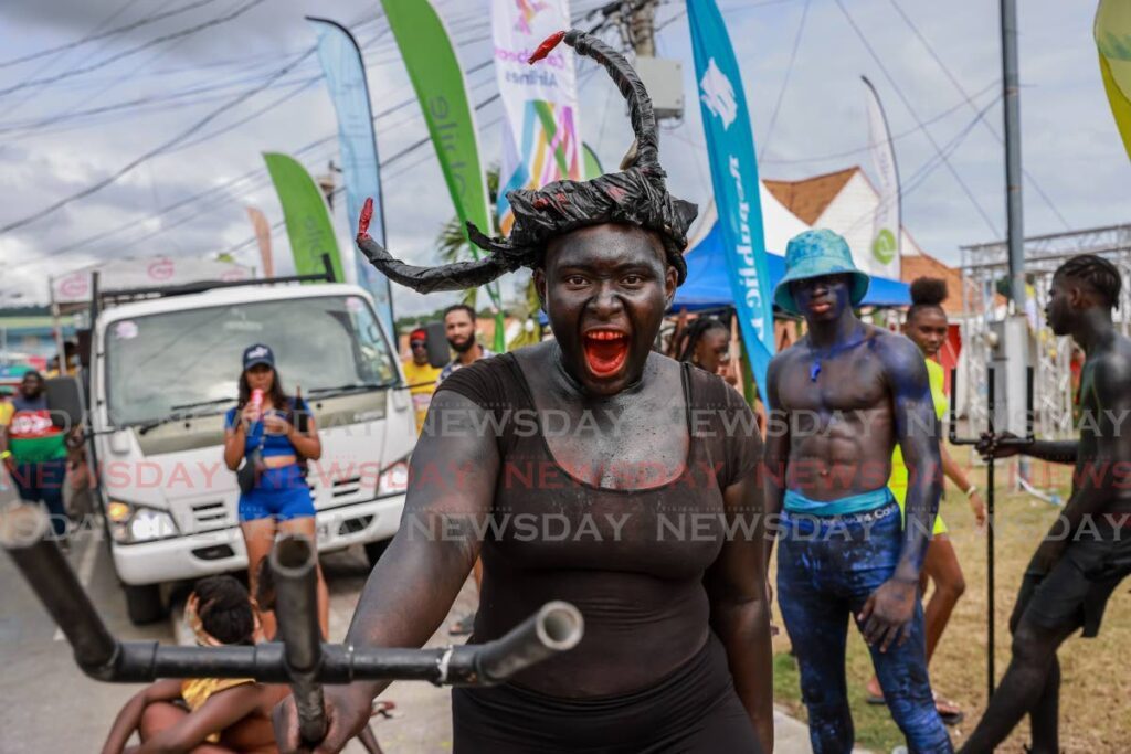 PAY D DEVIL: A traditional Carnival character on Milford Road, Scarborough, Tobago on October 29. - Photo by Jeff K. Mayers