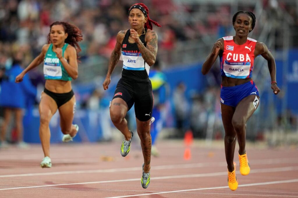 Cuba's Yunisleidy Garcia and Trinidad and Tobago's Michelle-lee Ahye run in a women's 100m semifinal at the Pan American Games in Santiago, Chile, on Monday. - AP PHOTO