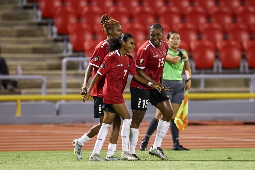 Trinidad and Tobago's Alexcia Ali (C) celebrates her goal against Puerto Rico with her teammates during the Road to Concacaf W Gold Cup match at the Hasely Crawford Stadium on Friday in Port of Spain. - Daniel Prentice