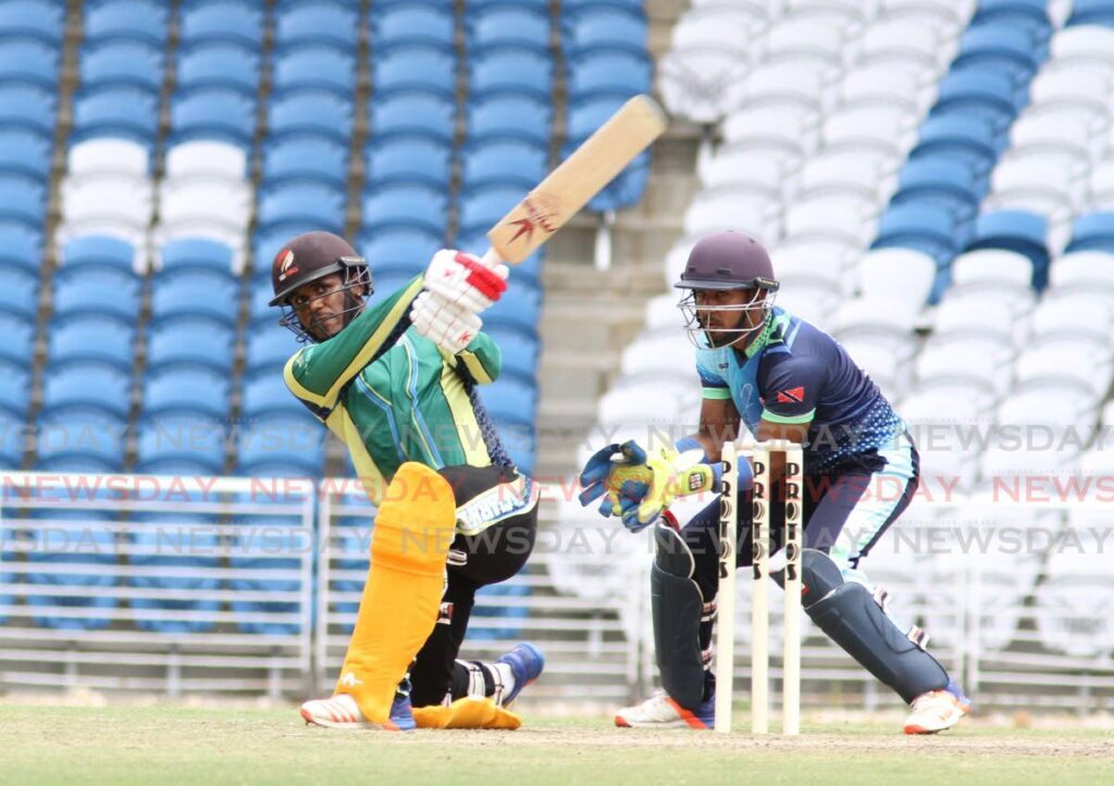 Yannick Ottley plays a slog sweep at the Brian Lara Cricket Academy in Tarouba. FILE PHOTO - 