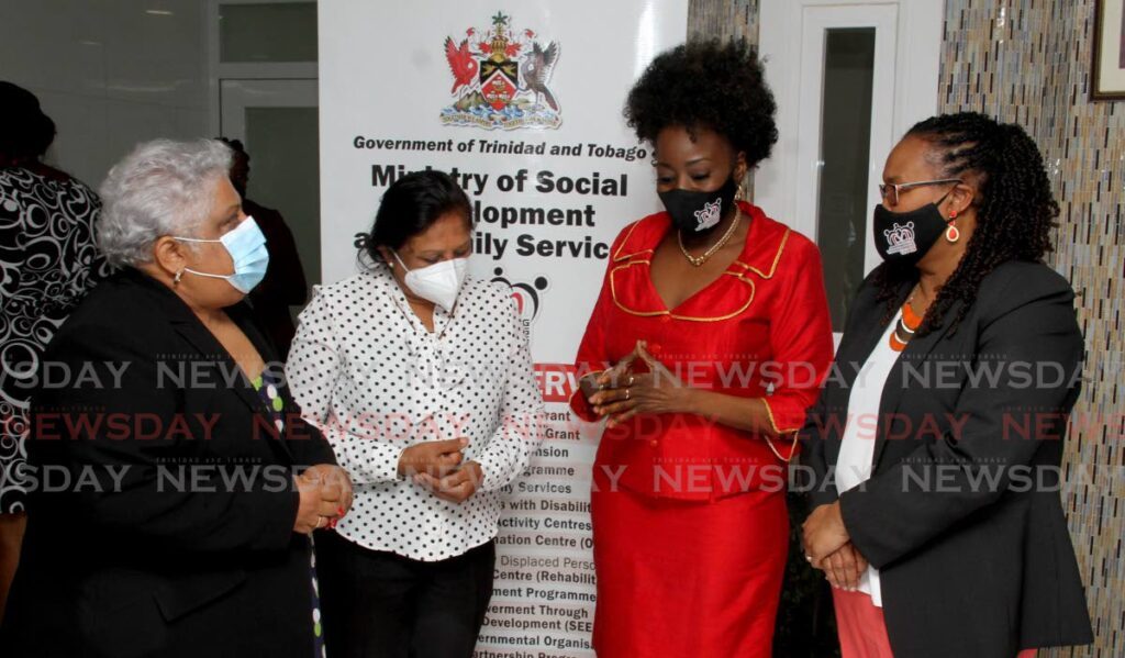 Grandmothers Susan Mungalsingh second from left and Julia Baptiste on right, with assistant director of National Services Division Kathleen Sarkar, left, and Minister of Social Development and Family Services Donna Cox, at the official launch of the Granparenting Programme, at the Ministry of Social Development and Family Services, St. Vincent Street, Port of Spain on August 8, 2021. FILE PHOTO/ANGELO MARCELLE - 