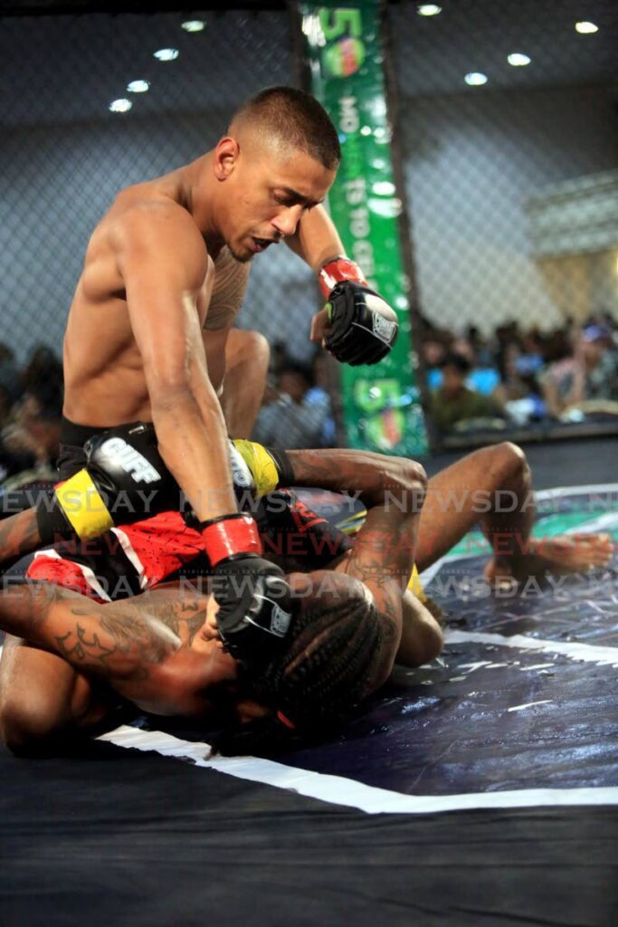 In this August 20, 2022 file photo, Aidan Williams looks to punch Marc Sarjent during the Caribbean Ultimate Fist Fighting mixed martial arts event, at Cascadia Hotel, St Ann's. - Sureash Cholai