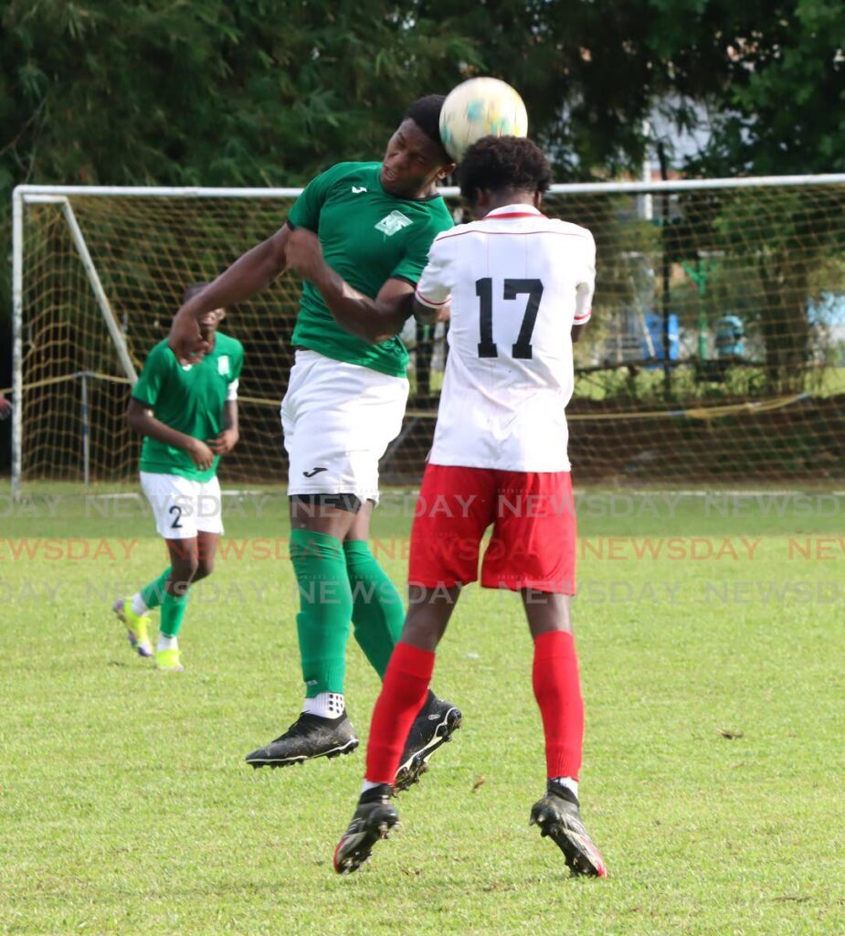 In this photo taken on October 18, San Juan North Secondary School defender Kent Guy (L) and St. Anthony's College midfielder Andell Fraser, battle for the ball during their Premiership Division match at St. Anthony's College Grounds, Westmoorings. - Angelo Marcelle