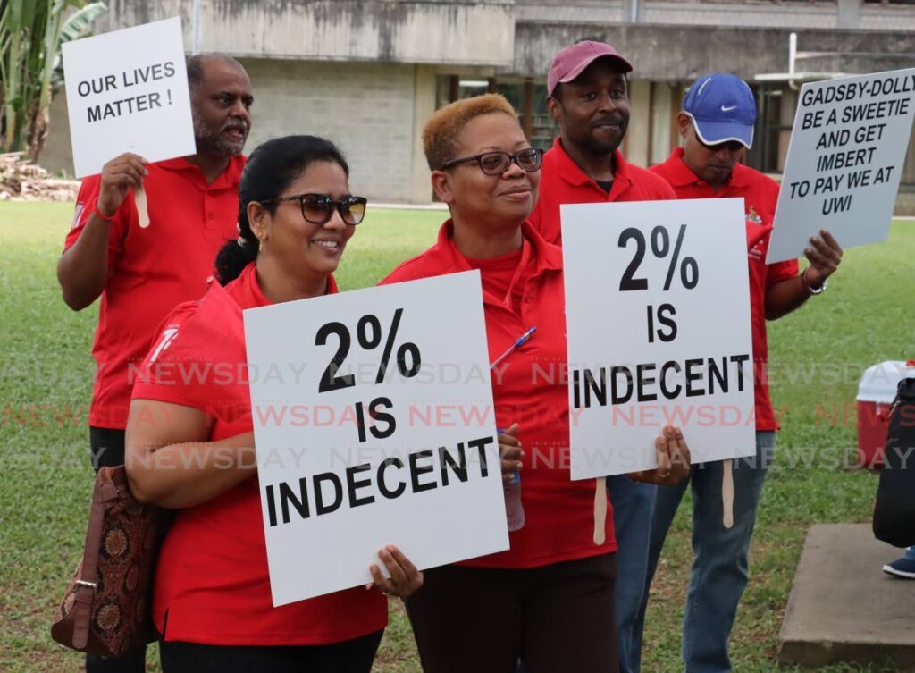 WIGUT members protest at the University of the West Indies (UWI) St Augustine Campus last Friday. - ROGER JACOB