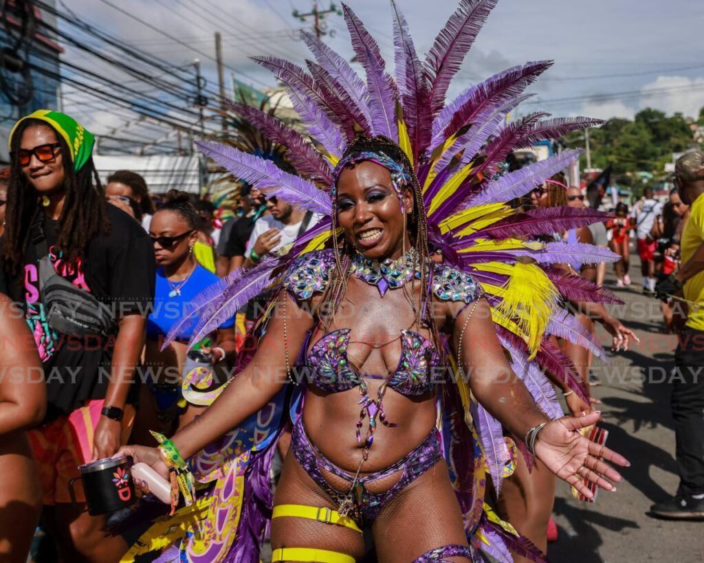 A member of Zain Carnival Experience at Tobago carnival's parade of the bands on Sunday. - Jeff K. Mayers
