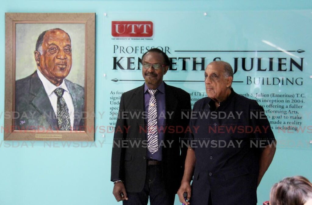 Prof Ken Julien, right, takes a photo with David Boothman near his plaque at UTT Tamana Campus, Churchill Roosevelt Highway, Wallerfield on November 1. - Ayanna Kinsale