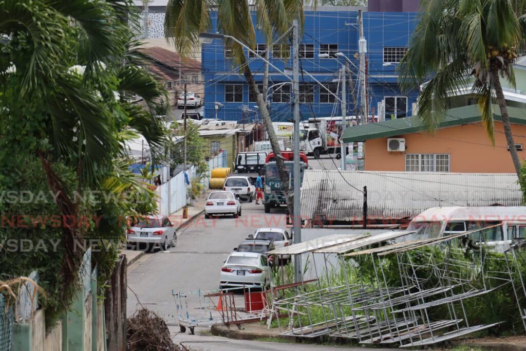 COMMUNITY IN MOURNING: A look from the hilltop at Jeffers Lane, St James after four men were shot at while liming. Two of the men, Steffan Belgrave and Darnell Pierre, died.  - Photo by Roger Jacob