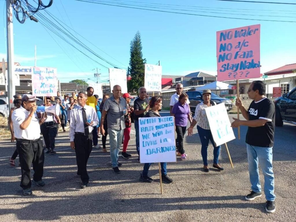 [MAIN] Couva residents and Couva South MP Rudranath Indarsingh stage a protest against the Regulated Industries Commission's proposed increase in electricty rates on Wednesday. PHOTO COURTESY RUDRANATH INDARSINGH - 