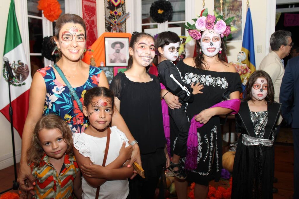 Mexicans attendees based in TT arrived with their faces painted as skulls, a tradition of their country. - Grevic Alvarado