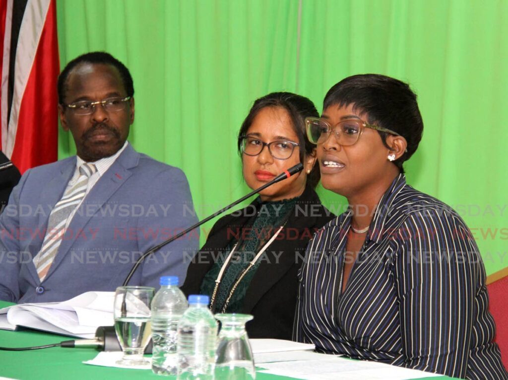 Cpl Dane-Marie Marshall, right, Director of the Counter Trafficking Unit Dr Samantha Chaitram and National Security Minister Fitzgerald Hinds during the press conference on Friday to announce the conviction of Anthony Smith. - Ayanna Kinsale