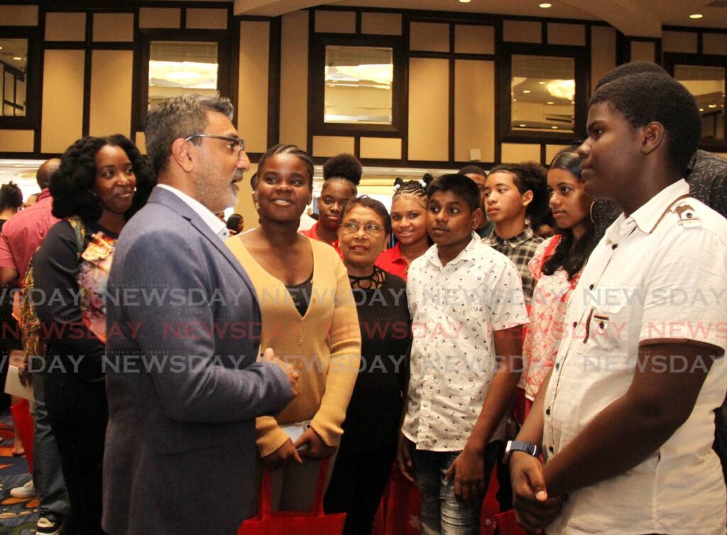 Canadian High Commissioner to TT Arif Keshani speaks with students of Malabar Secondary School during the College Fair at Hilton hotel, Port of Spain on Saturday.  - Ayanna Kinsale
