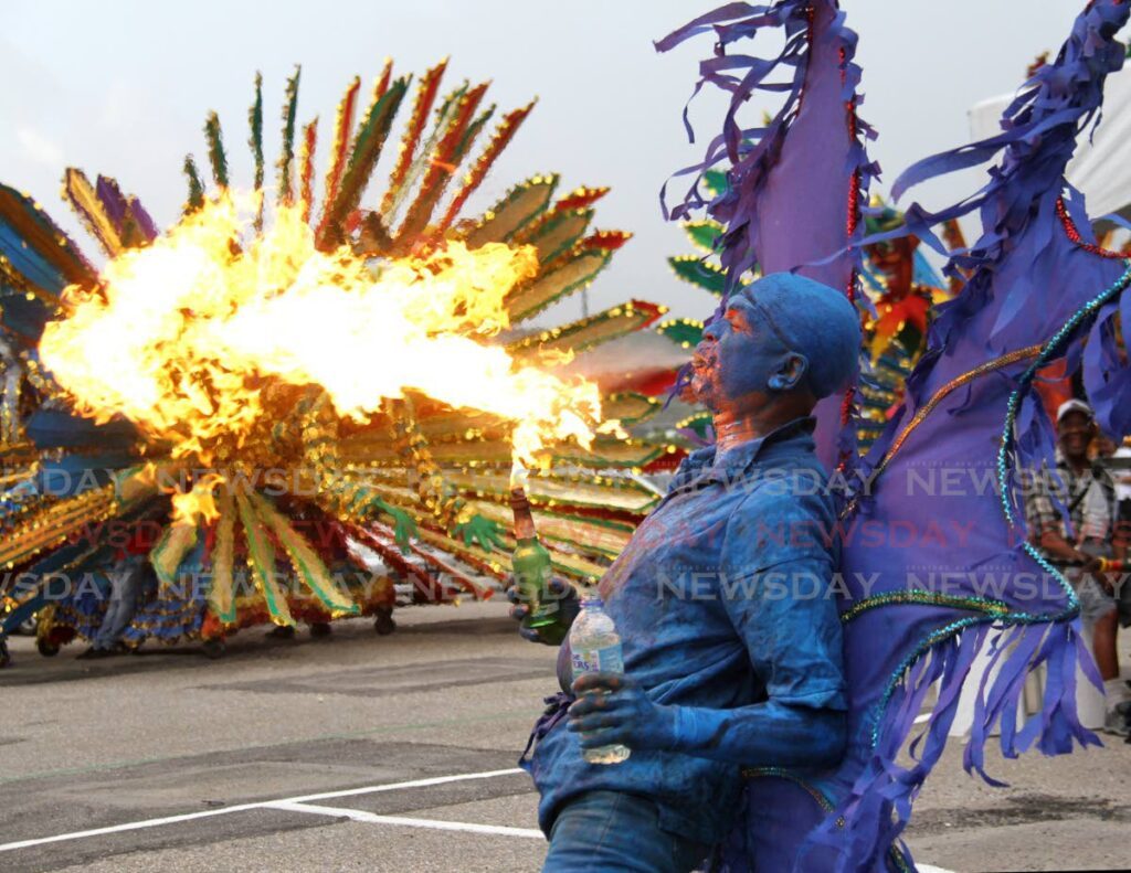 A blue devil shows off his skills during the launch of Carnival 2024, Carnival City, Queen's Park Savannah, Port of Spain on Saturday.  - Ayanna Kinsale