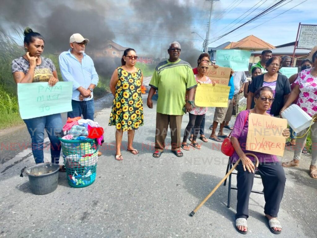 WEEKEND PROTESTS: Residents of several communities in San Francique brought baskets of dirty clothes out to a protest on Saturday over three-months of no water in their pipes.  - 