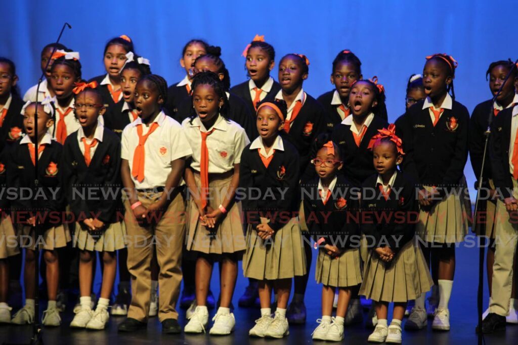 Students from the Scholastic Academy perform in the choral speaking category at the NGC National Junior Arts Festival at Naparima Bowl, San Fernando, on Tuesday. - Lincoln Holder