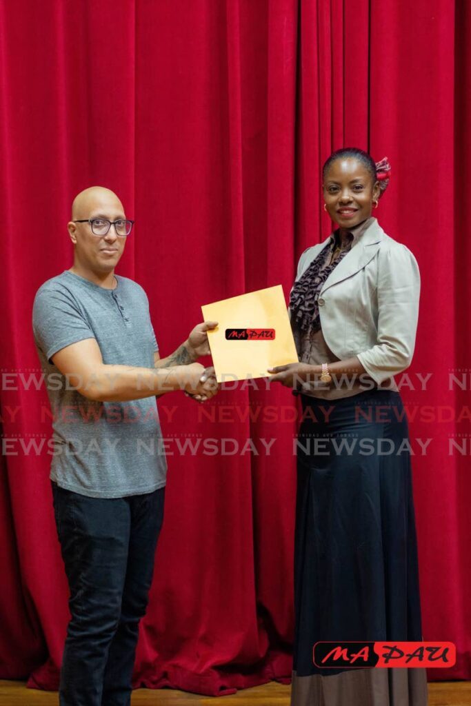 Testicular cancer patient Blaine Gomes (left) receives a cheque for $12,500 from Ma Pau chairman and former Miss Universe Wendy Fitzwilliams (right) at City Hall Auditorium, on Knoxx Street, Port of Spain. - Photo by Joey Bartlett