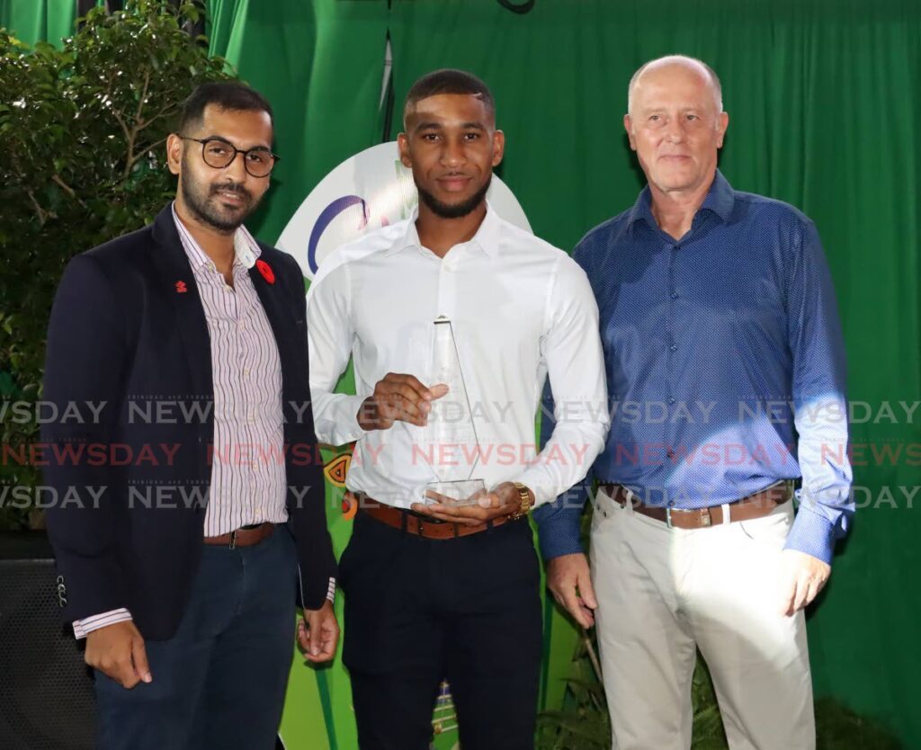From left: Prince's Trust international programmes manager Siddel Ramkisson, Caribbean Youn Achievers Award winner Adrian Whiteman and Proman Foundation chairman Claus Cronberger at Starlift House of Music, Samuel Drive, St James, on Wednesday night. - ROGER JACOB