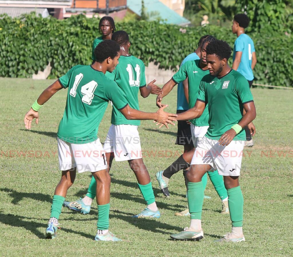 San Juan Secondary players celebrate one of the eight goals they scored against El Dorado West Secondary on Thursday in intercol action at the San Juan Secondary school ground. PHOTO BY ROGER JACOB - ROGER JACOB