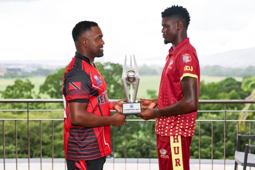Red Force skipper Darren Bravo, left, with Leeward Islands Hurricanes captain Alzarri Joseph as they hold the CG United Super50 trophy prior to the final earlier this month. PHOTO COURTESY CRICKET WEST INDIES  - 