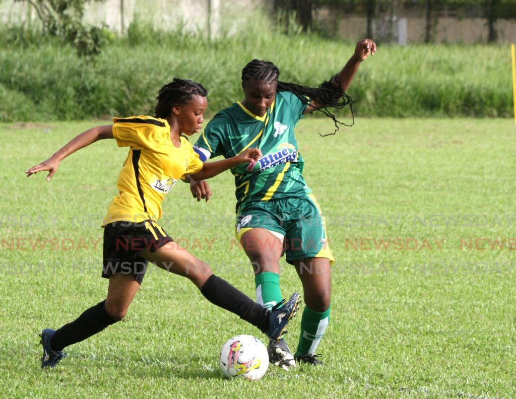 Tranquility Secondary’s Kelicia Aguillera (L)  and Diego Martin Central Secondary’s Keziah Mc Pherson go after the ball during the Girls Intercol Zonal quarter-finals at the Diego Martin North Secondary Grounds, on Saturday. - Ayanna Kinsale