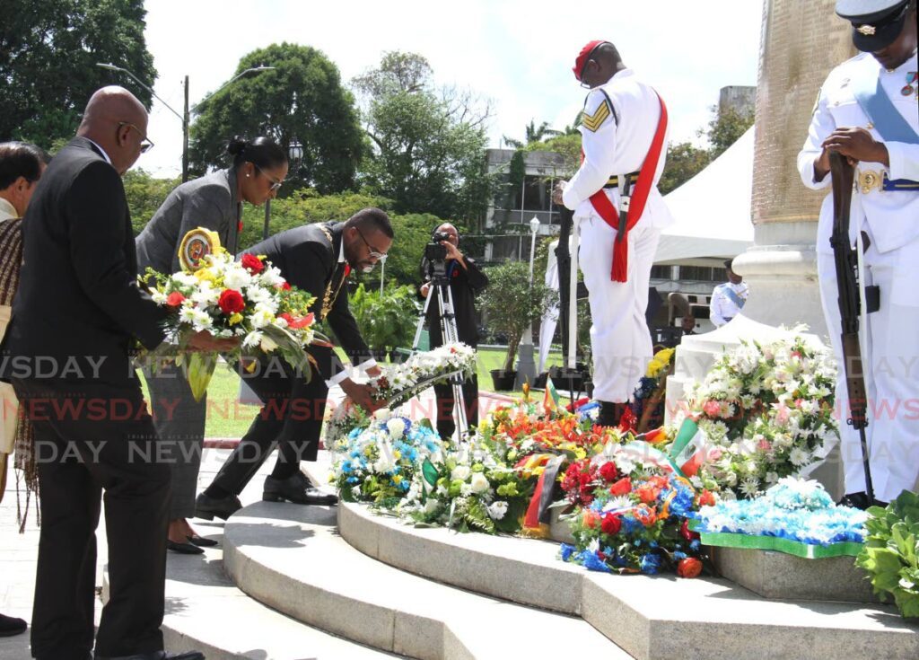Port of Spain mayor Chinua Alleyne lays a wreath at the Cenotaph at Memorial Park, Frederick Street, Port of Spain, during the National Day of Remembrance Parade on Sunday. - Ayanna Kinsale