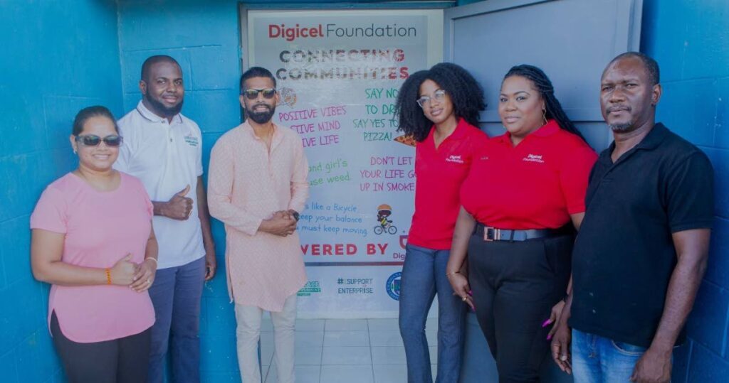 From left, Chaguanas East MP Vandana Mohit; president of the Dass Trace Youth Empowerment Committee Justin Lewis, Chaguanas mayor Faaiq Mohammed, Digicel Foundation’s finance accountant Misha Jackman, Digicel Foundation director La Toya Gopaul and the committee’s chairman Rolston De Coteau, at the official reopening of the Dass Trace Youth Empowerment Centre. - 