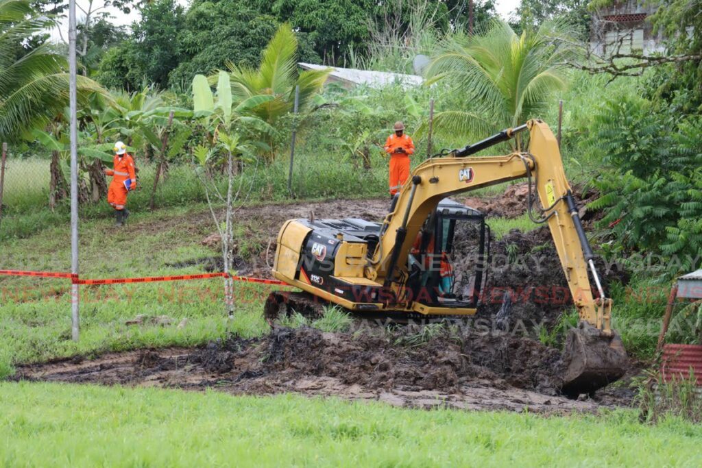 Emergency operations by Heritage Petrolum to clean up an oil leak in Fyzabad on Thursday. - Photo by Roger Jacob