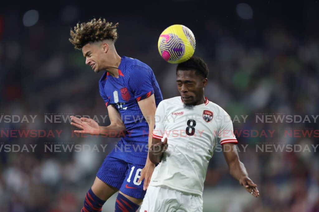 HEADS HIHG: US forward Kevin Paredes, left, and Soca Warriors midfielder Noah Powder try to head the ball during the first leg of the Nations League quarterfinal on Thursday in Austin, Texas. AP PHOTO  - Stephen Spillman