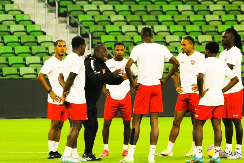National football coach Angus Eve talks to his players during a training session in Austin, Texas last week ahead of the 1st leg of their Concacaf Nations League quarterfinal vs USA.  - TTFA Media
