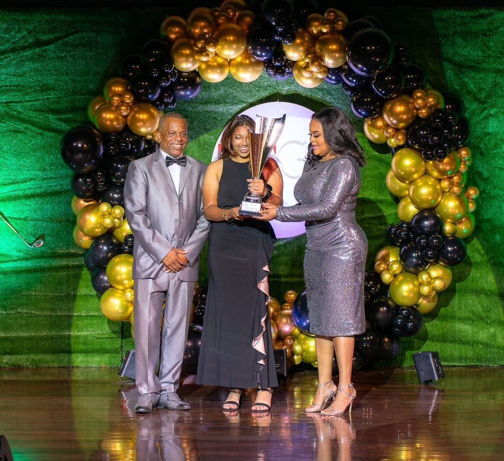 Chloe Ajodha, middle, receives the women's player of the year award at the TT Golf Association award ceremony from Minister of Sport and Community Development Shamfa Cudjoe-Lewis. At right is TTGA president Wayne Baptiste. - Courtesy Ministry of Sport and Community Development