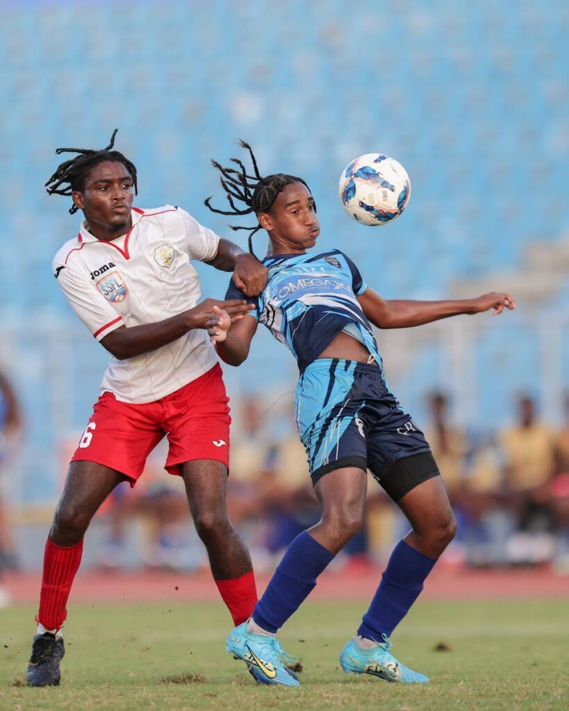 QRC’s Tau Lamsee (R) controls the ball ahead of St Anthony’s College Davoure Thomas during the SSFL North Zone Intercol final match at Hasely Crawford Stadium on Thursday, in Port of Spain. St Anthony’s College won 5-3 via penalties.  - DANIEL PRENTICE