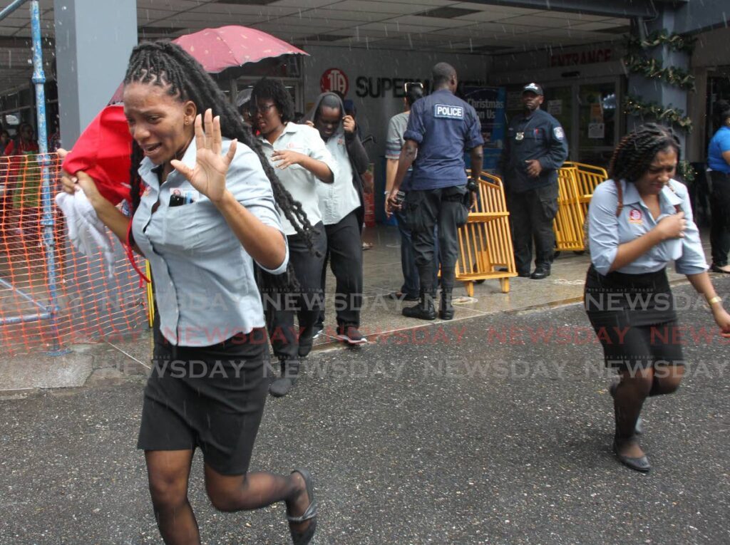 JTA supermarket employees are being evacuated after a bomb threat was called in at Carlton Centre, San Fernando, on Friday. No bomb was found when police searched the premises. - Lincoln Holder