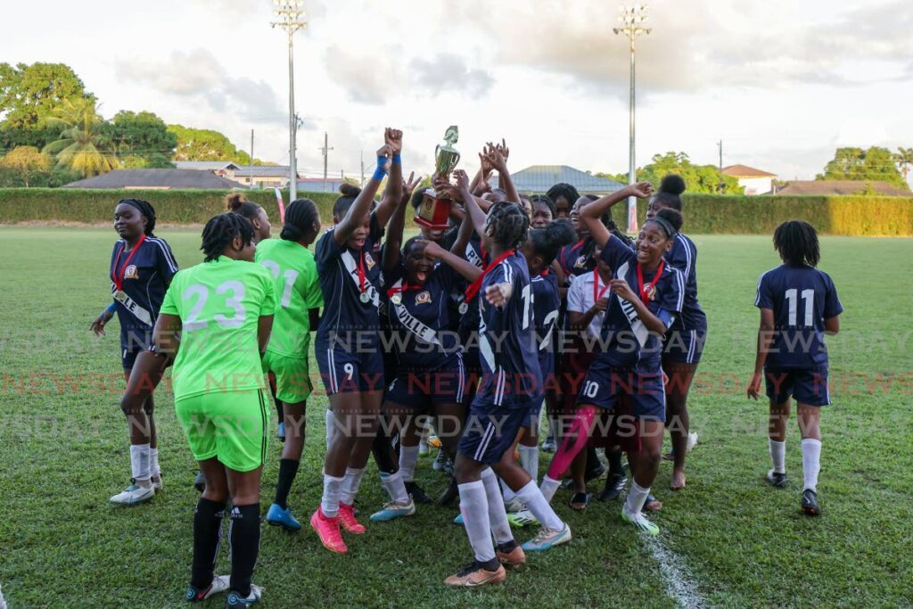 Pleasantville Secondary celebrate their SSFL Girls South Zone Intercol title after defeating St Joseph Convent San Fernando at Mahaica Sporting Complex on Friday. - DANIEL PRENTICE