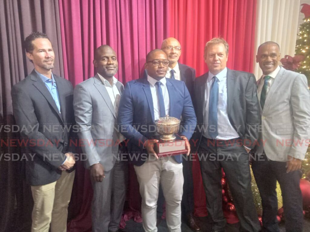 The Queen's Park 8-a-side football committee with their Kingston award at the annual QPCC dinner and awards on Friday, at the Century Ballroom, Queen's Park Cricket Club, St Clair.  - Stephon Nicholas