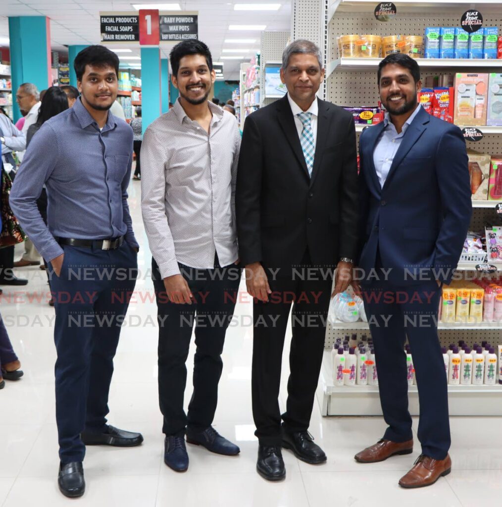 Pennywise Cosmetics ltd CEO Dalvi Paladee and his sons Shrvanam, Satyam, and Shivum,  at the official opening the company's newly relocated Lord Kitchener Avenue, Arima store on Monday. - Photo by Angelo Marcelle