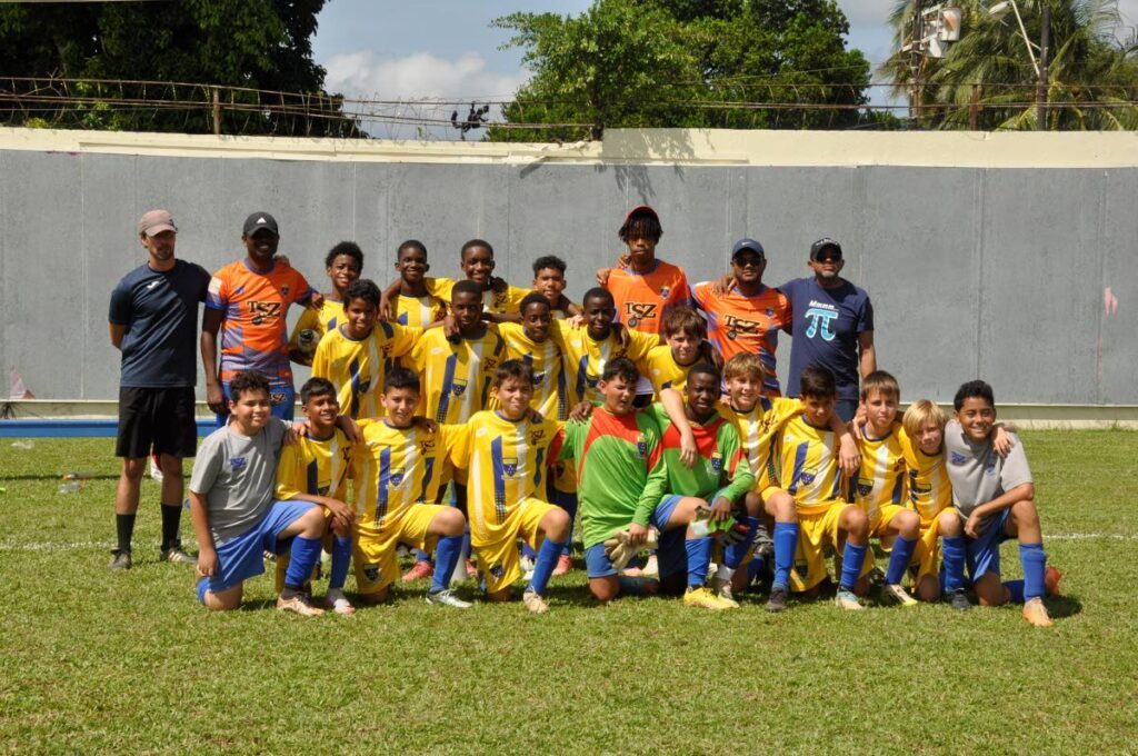 Fatima’ under-13 football team and tehcnical staff members. Included in this team photo are Fatima principal Ronald Cooper (back row, extreme right and coach Damien Frederick (back row, second from left). - Fatima College 