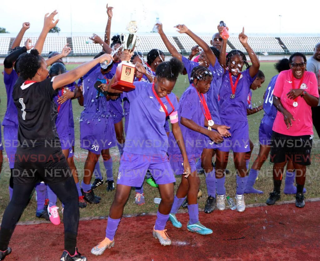 Five Rivers Secondary School footballers celebrate after winning their Coca-Cola Girls East Intercol final against San Juan North Secondary School, at the Larry Gomes Stadium on Monday.  - Angelo Marcelle