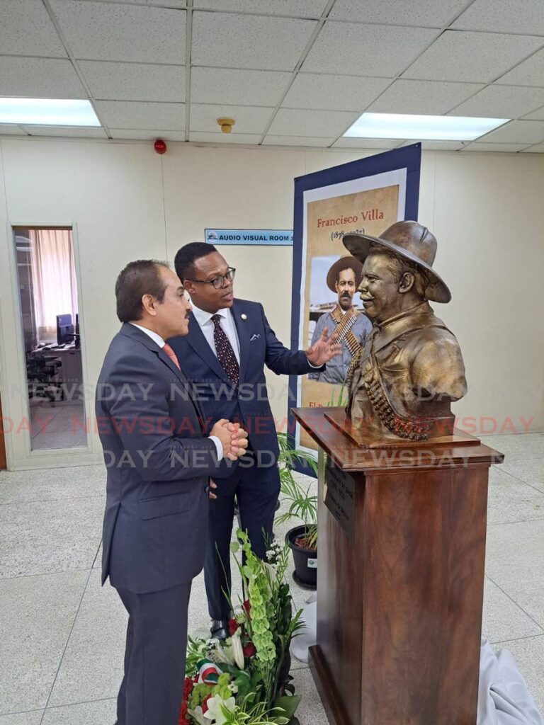Victor Hugo Morales Meléndez ambassador Mexico and Senator Dr Amery Browne, Minister of Foreign and CARICOM Affairs, pose for a photo to celebrate the unveiling of the Francisco Villa Bust. - Photo by Grevic Alvarado