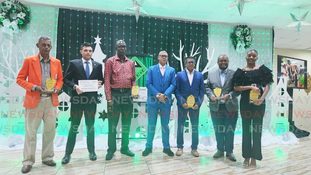 From left. Vallence Rambharat of Hunters Search and Rescue, Emile Ramkissoon of New Wave Marketing Ltd, Larry Seales who collected the excellence in sports award on behalf of his son Jayden Seales, Mukesh Ramsingh, President of the Couva Point Lisas Chamber, Fareed Hosein of Asequith Engineering and Contracting Ltd, Larry Holder of Novo Farms and Mayaya Huggins at the Couva Point Lisas chamber dinner and awards. -Photo by Yvonne Webb 
