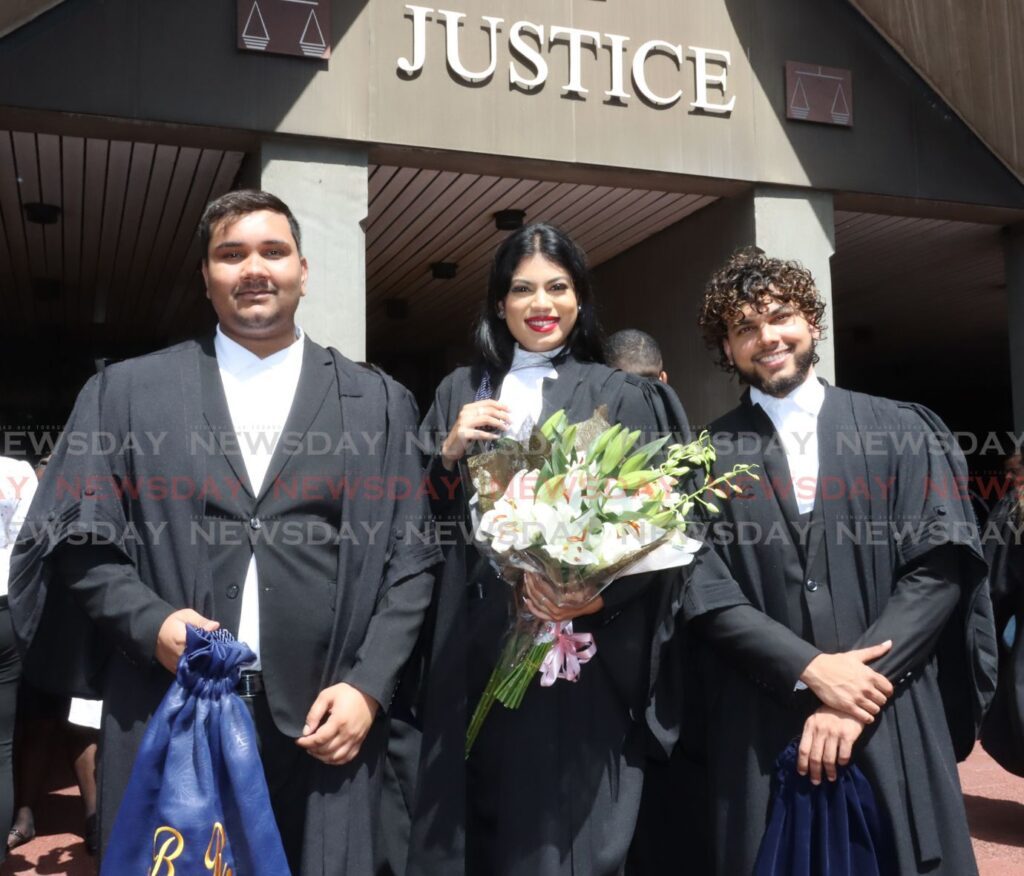 Called to the Bar, Brandon Ragoonanan, Chelsea Nandial and Mikhail Sawah,
New lawyers called to the bar pose for photos with family and friends on the steps of the Hall of Justice, Knox Street Port of Spain on Friday - Photo by Roger Jacob