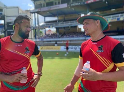 Rayad Emrit, left, chats with compatriot Joshua Da Silva during the 2020 CPL. - 
