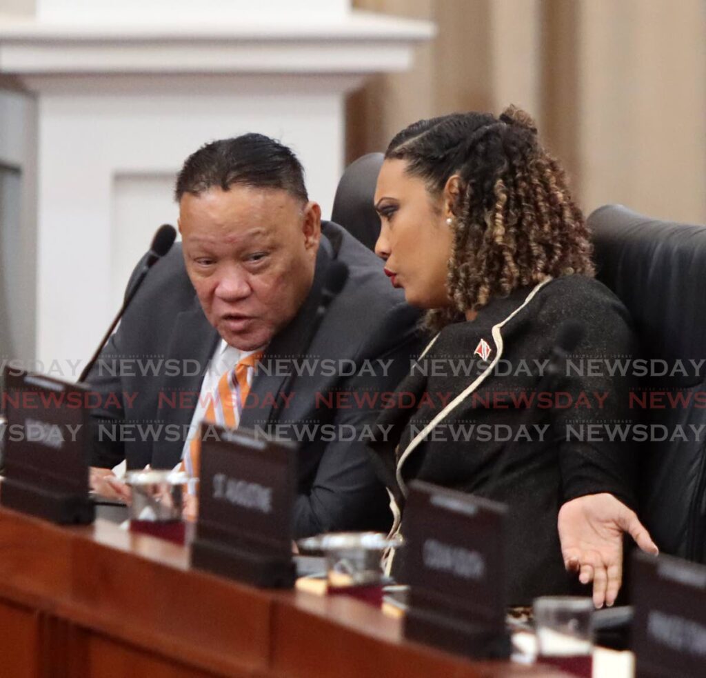 St Augustine MP Khadijah Ameen and Pointe-a-Pierre MP David Lee during a recent sitting of Parliament. - Photo by Angelo Marcelle