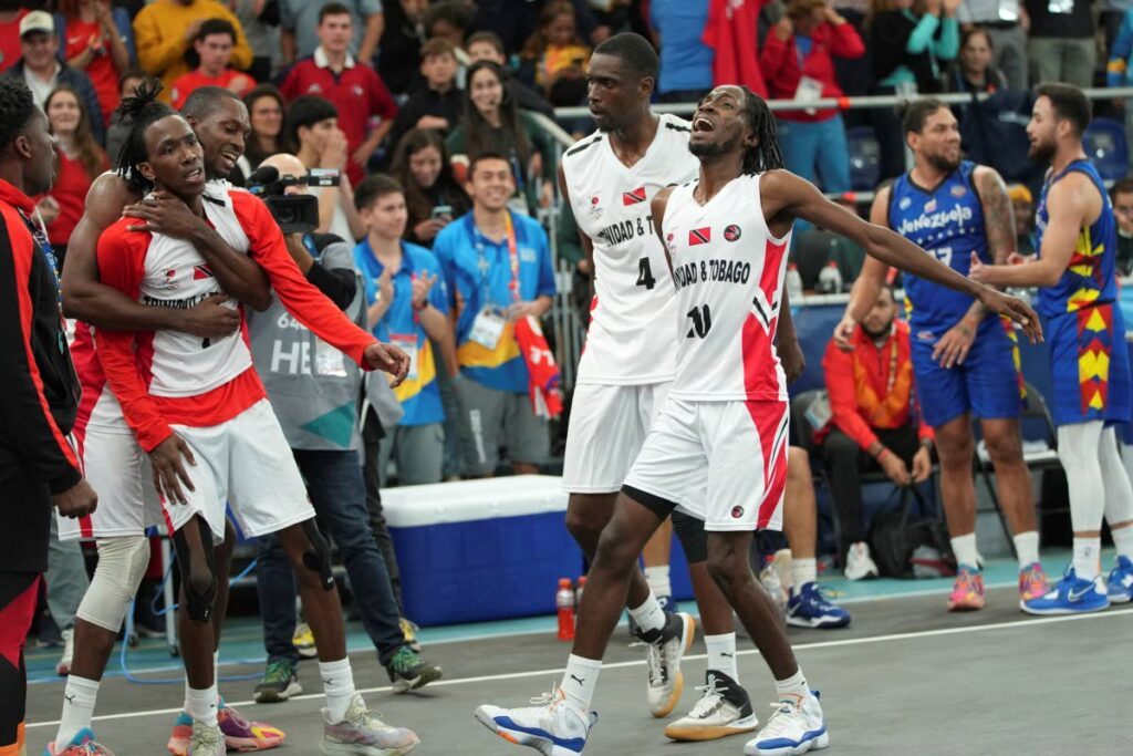 In this October 23 file photo, TT players celebrate the bronze medal win in men's 3x3 basketball event of the Pan American Games in Santiago, Chile. - AP PHOTO