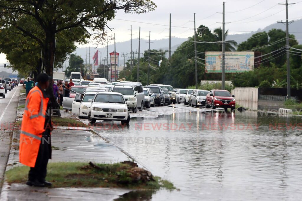 Traffic pile up along the flooded Churchill Roosevelt Highway, Trincity on October 25. - File photo/Angelo Marcelle